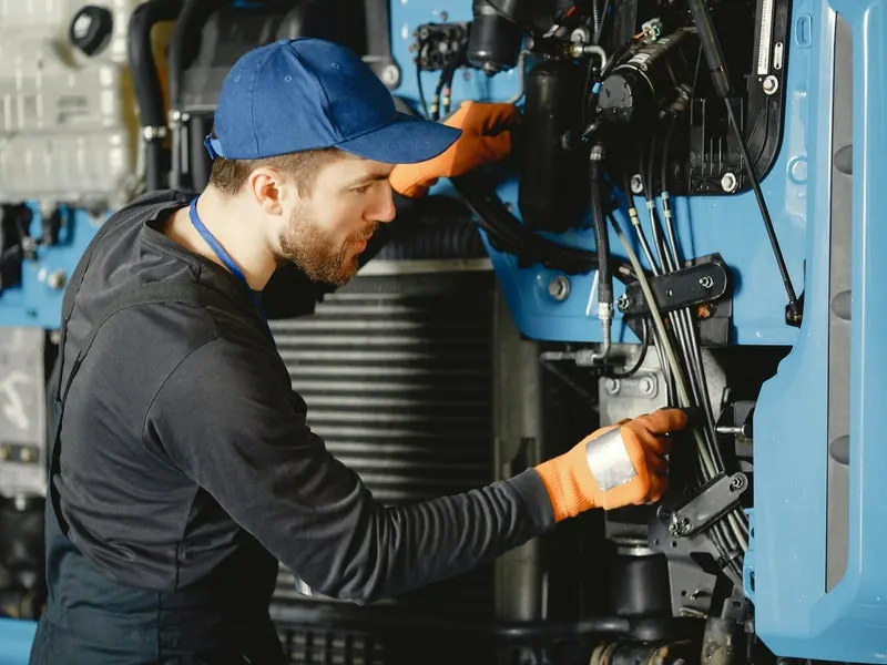 PK Marine Service technician working on a boat engine — marine repair in Bristol, Rhode Island